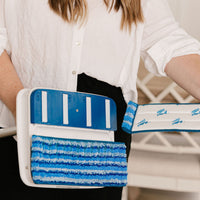 Person taking reusable Nellie's Scrub & Polish Pad off of Nellie's Wow Too Mop
