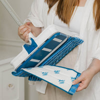 Person taking off Scrub & Polish Pad of the Wow Too Mop.