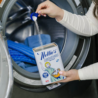 Person using Nellie's Laundry Soda in their washing machine to clean Nellie's Scrub & Polish Pads