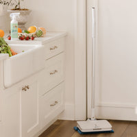 Wow Too Mop in corner of the kitchen with Nellie's Fruit and Veggie Wash spray on kitchen counter.