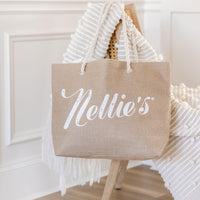 Brown Jute Tote bag with rope handles hanging on chair