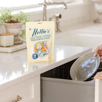Putting dirty dish into dishwasher