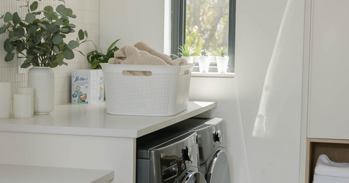 Laundry on counter in laundry room.