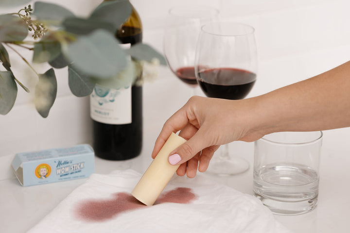 Removing a wine stain with Nellie's WOW Stick stain remover. 