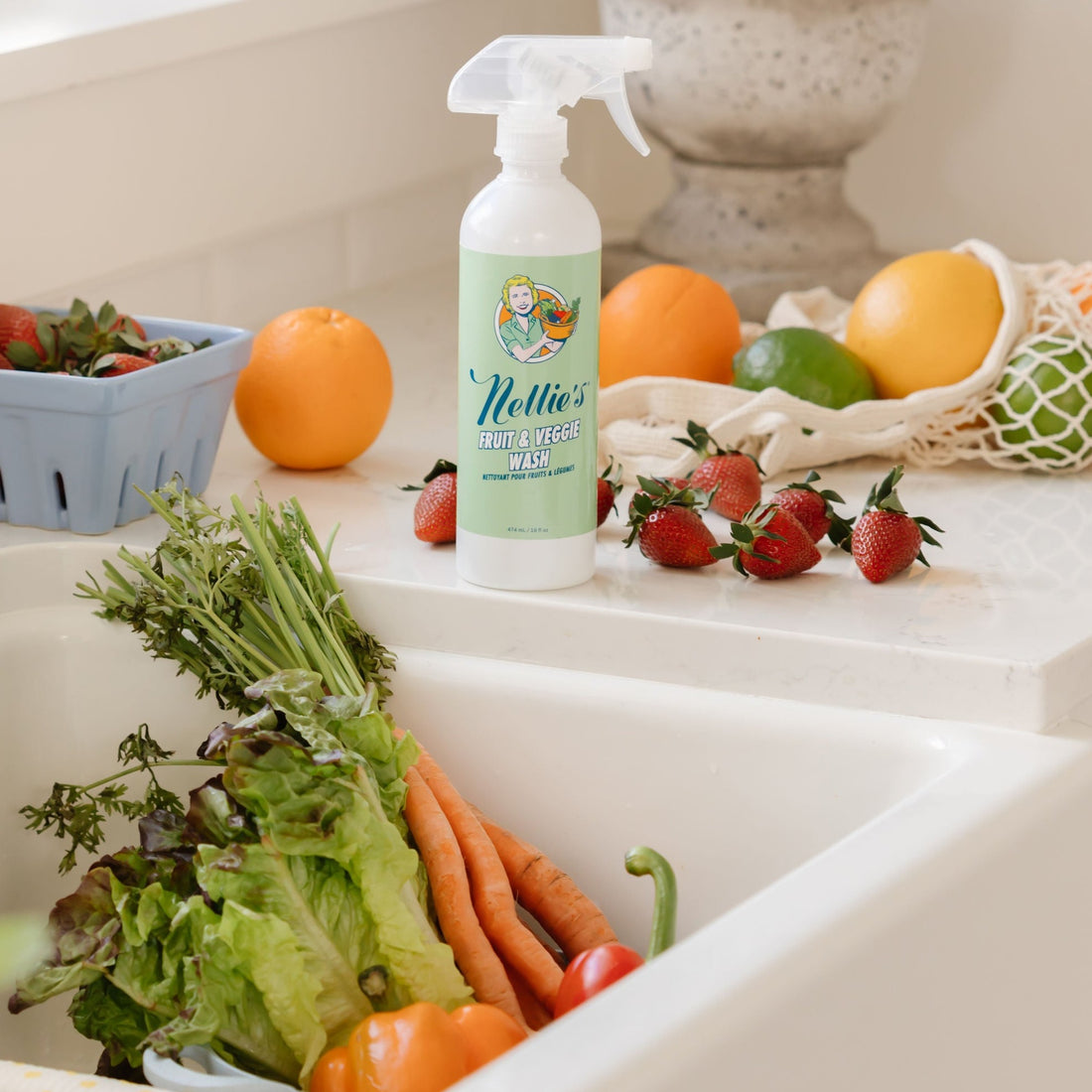 Vegetables in sink with Fruit and Vegetable wash spray on counter