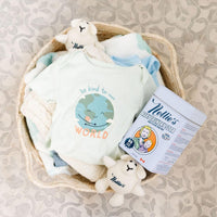 Basket with baby clothes and Baby Laundry detergent