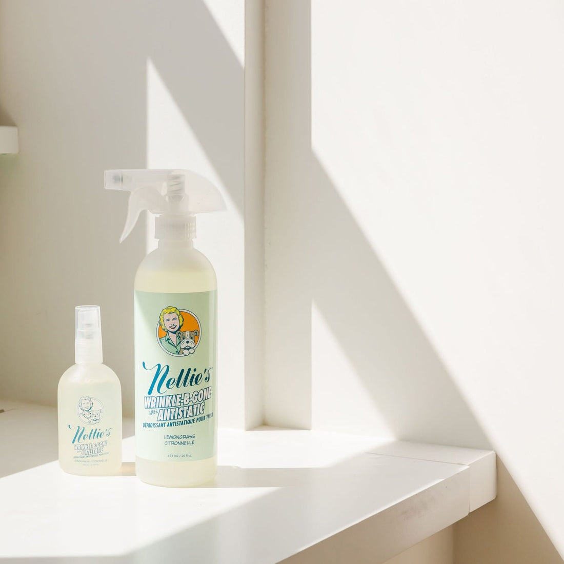 Large plastic bottle and small glass bottle of Nellie's Wrinkle-B-Gone in window